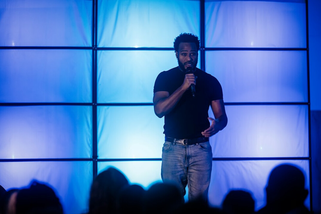 person speaking confidently on stage