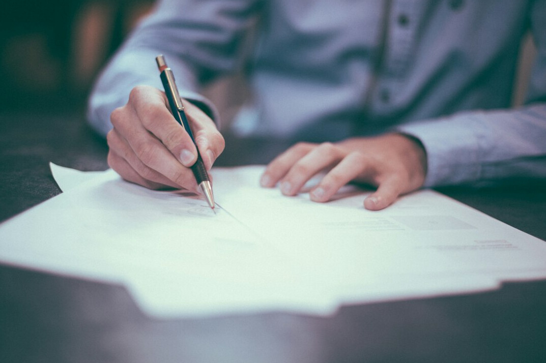 person writing notes