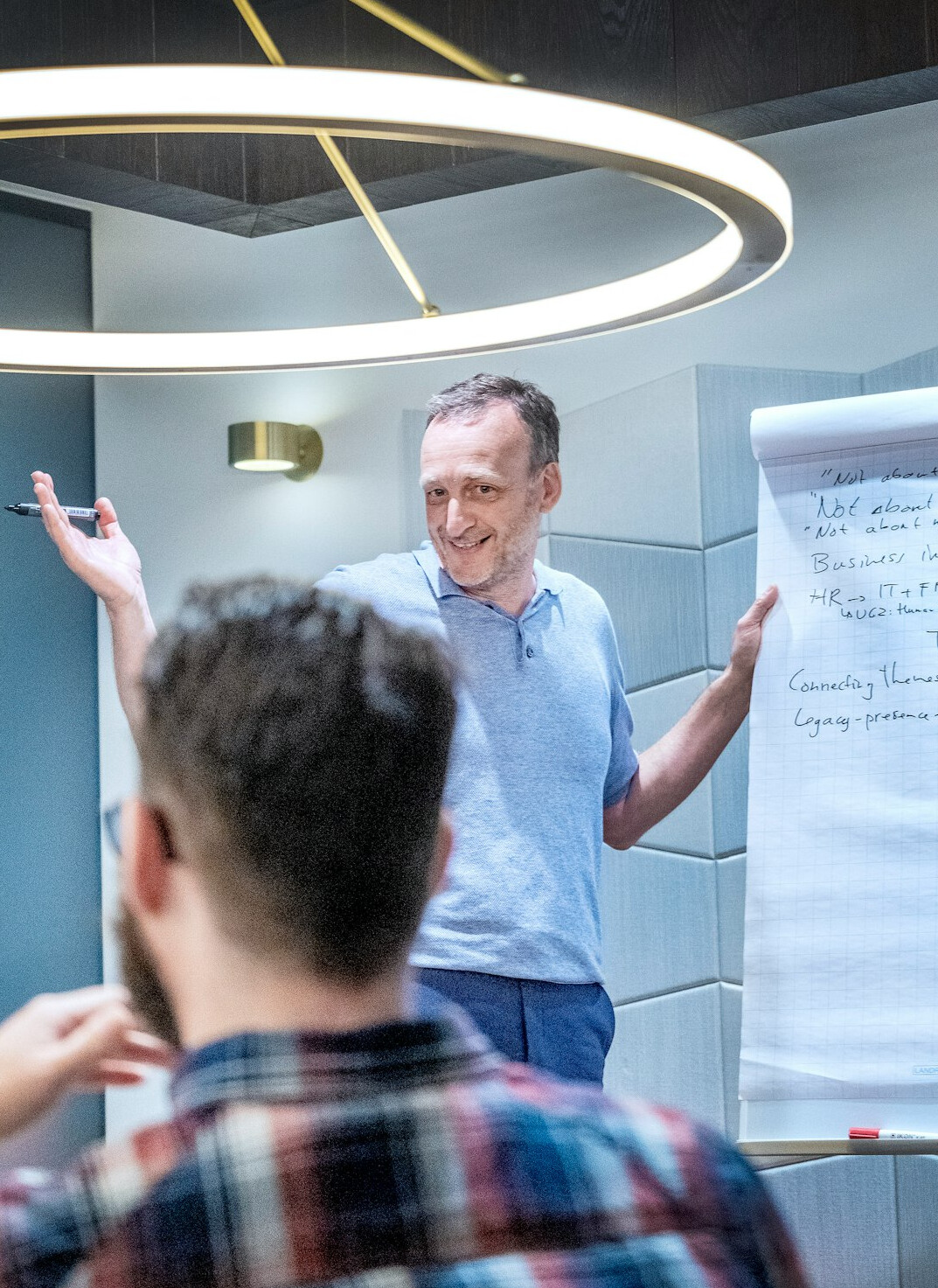 man presenting ideas to colleagues