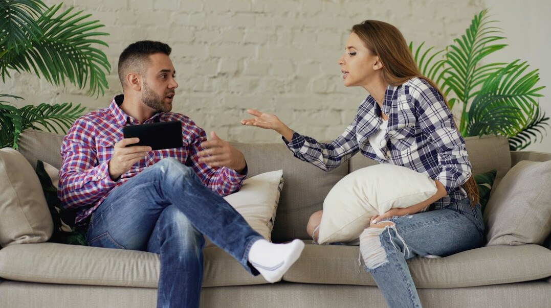 couple talking on couch
