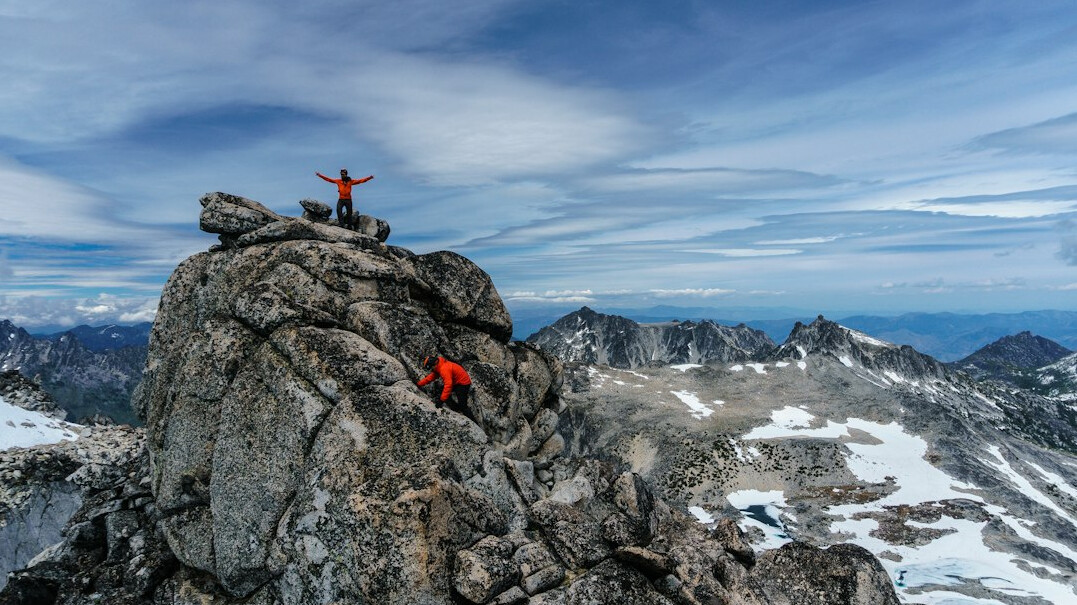 person climbing mountain