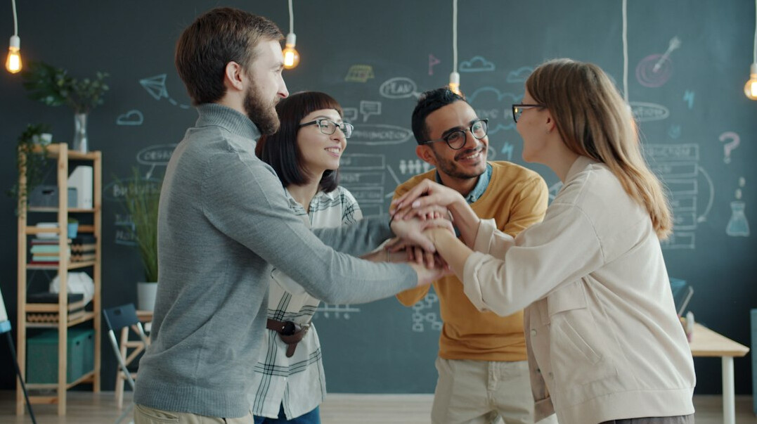 Bright collaborative workspace with people talking